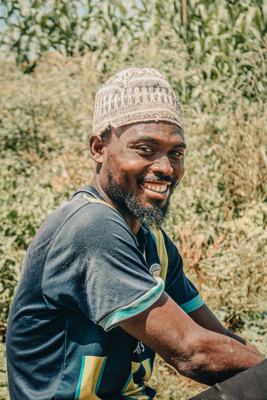 Smiling farmer in a green field